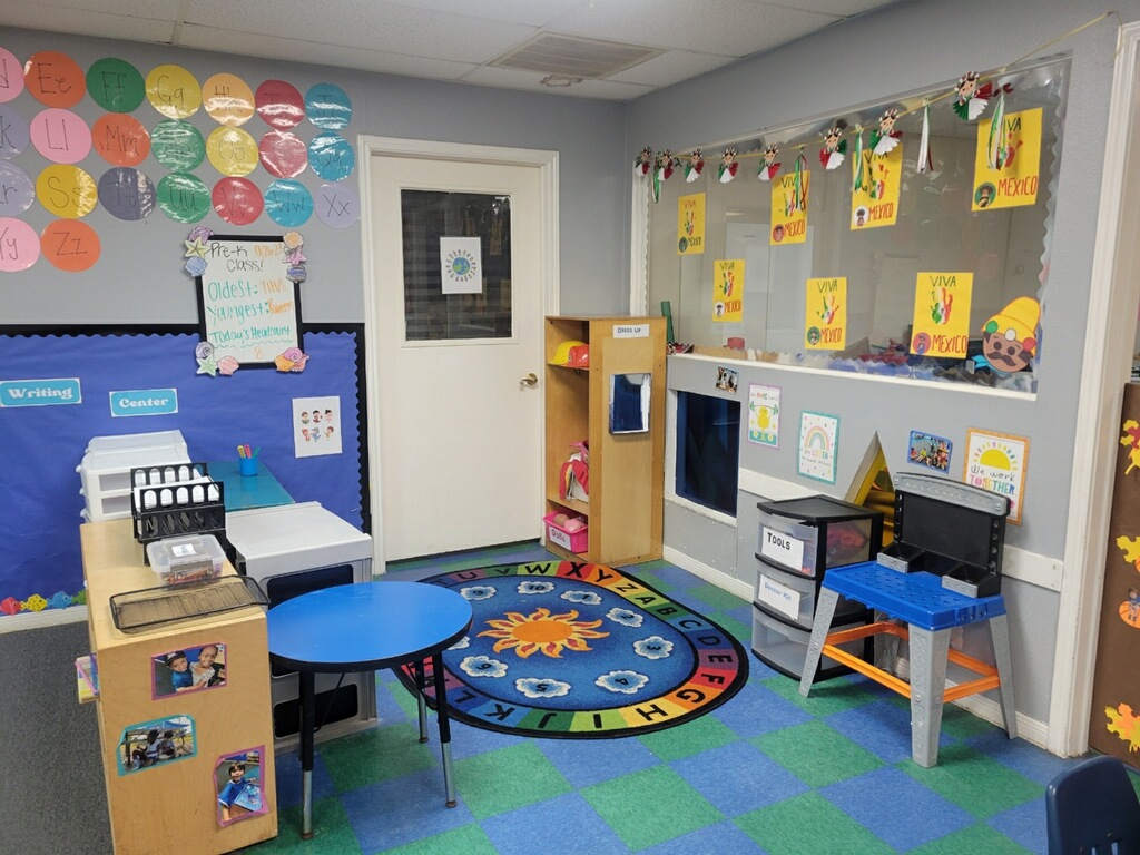 Pre-K classroom with an alphabet rub, cubbies, and encouraging posters